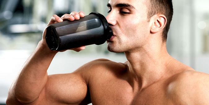Man drinking pre workout | The Fittest Blogger